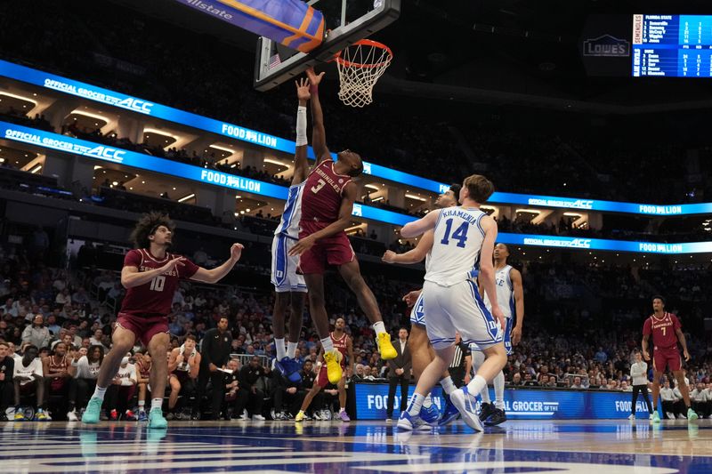 Mar 12, 2026; Charlotte, NC, USA; Florida State Seminoles guard Thomas Bassong (3) goes to the basket againstDuke Blue Devils guard Dame Sarr (7) during the second half at Spectrum Center. Mandatory Credit: Jim Dedmon-Imagn Images Mar 12, 2026; Charlotte, NC, USA; Florida State Seminoles guard Thomas Bassong (3) goes to the basket againstDuke Blue Devils guard Dame Sarr (7) during the second half at Spectrum Center. Mandatory Credit: Jim Dedmon-Imagn Images