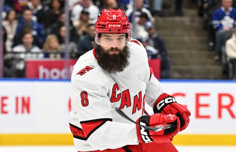 Dec 30, 2023; Toronto, Ontario, CAN; Carolina Hurricanes defenseman Brett Burns (8) pursues the play against the Toronto Maple Leafs in the first period at Scotiabank Arena. Mandatory Credit: Dan Hamilton-USA TODAY Sports