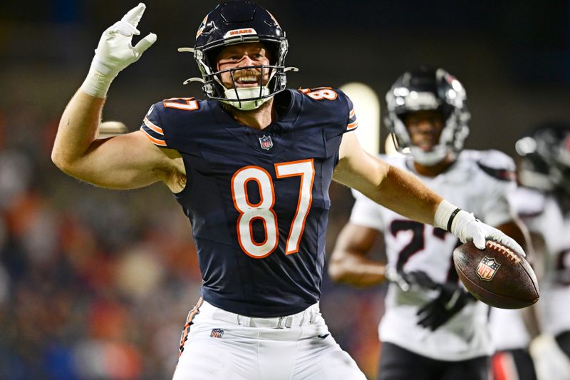 Chicago Bears tight end Brenden Bates (87) celebrates after a first down during the second half of an NFL exhibition Hall of Fame football game against the Houston Texans, Thursday, Aug. 1, 2024, in Canton, Ohio. (AP Photo/David Dermer)