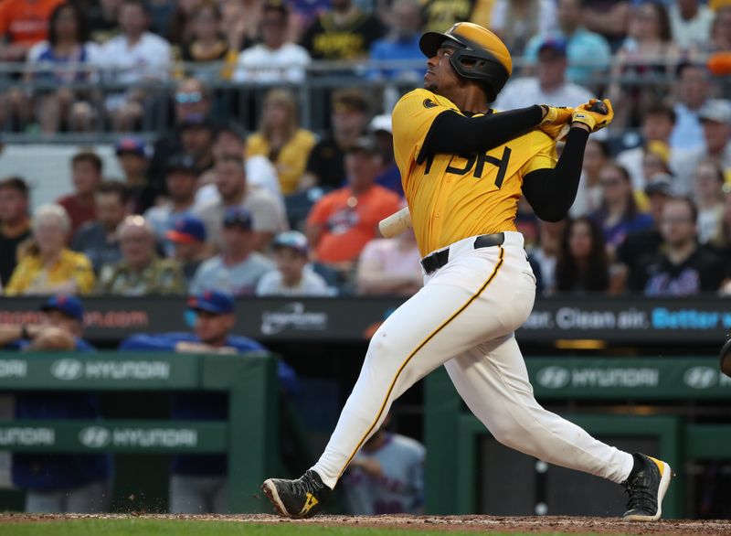 Jun 27, 2025; Pittsburgh, Pennsylvania, USA;  Pittsburgh Pirates third baseman Ke'Bryan Hayes (13) hits an RBI double against the New York Mets during the fifth inning at PNC Park. Mandatory Credit: Charles LeClaire-Imagn Images