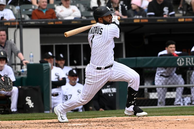 Apr 5, 2023; Chicago, Illinois, USA;  Chicago White Sox second baseman Elvis Andrus (1) hits his 2000th career hit during the fifth inning against the San Francisco Giants  at Guaranteed Rate Field. Mandatory Credit: Matt Marton-USA TODAY Sports