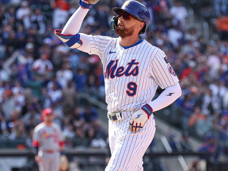Apr 20, 2025; New York City, New York, USA; New York Mets left fielder Brandon Nimmo (9) reacts after hitting an RBI single during the seventh inning against the St. Louis Cardinals at Citi Field. Mandatory Credit: Vincent Carchietta-Imagn Images