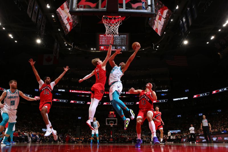 TORONTO, CANADA - MARCH 3: Grant Williams #2 of the Charlotte Hornets  drives to the basket during the game against the Toronto Raptors on March 3, 2024 at the Scotiabank Arena in Toronto, Ontario, Canada.  NOTE TO USER: User expressly acknowledges and agrees that, by downloading and or using this Photograph, user is consenting to the terms and conditions of the Getty Images License Agreement.  Mandatory Copyright Notice: Copyright 2024 NBAE (Photo by Vaughn Ridley/NBAE via Getty Images)