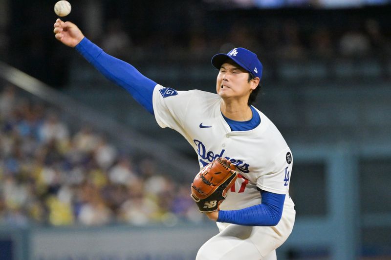 Sep 16, 2025; Los Angeles, California, USA; Los Angeles Dodgers starting pitcher Shohei Ohtani (17) delivers a pitch during the first inning against the Philadelphia Phillies at Dodger Stadium. Mandatory Credit: Jayne Kamin-Oncea-Imagn Images