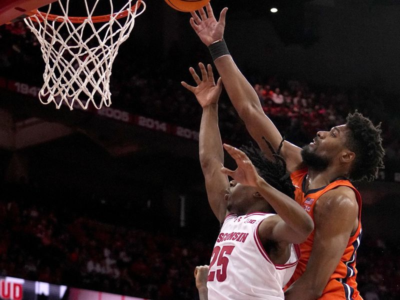 Mar 2, 2024; Madison, WI, USA; Illinois forward Quincy Guerrier (13) scores on Wisconsin guard John Blackwell (25) during the first half of their game Saturday, March 2, 2024 at the Kohl Center in Madison, Wisconsin.
 Mandatory Credit: Mark Hoffman-USA TODAY Sports