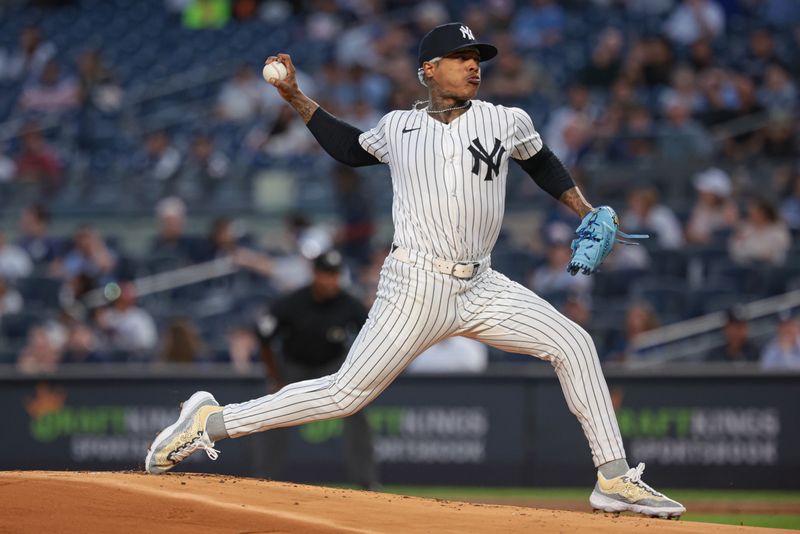 Sep 10, 2024; Bronx, New York, USA; New York Yankees starting pitcher Marcus Stroman (0) delivers a pitch during the first inning against the Kansas City Royals at Yankee Stadium. Mandatory Credit: Vincent Carchietta-Imagn Images