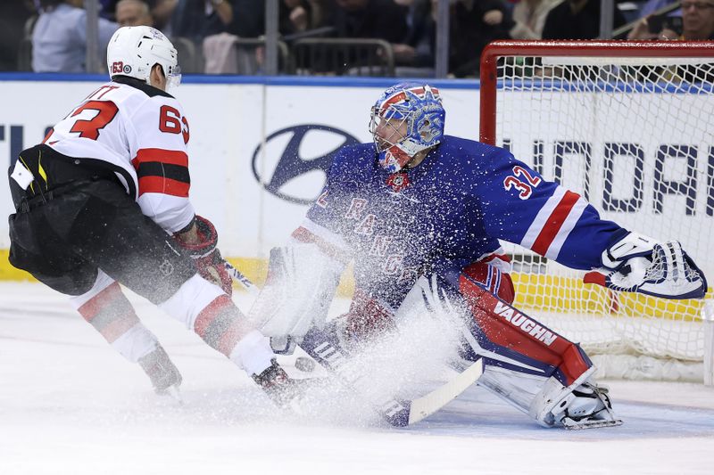 Mar 11, 2024; New York, New York, USA; New York Rangers goaltender Jonathan Quick (32) makes a save against New Jersey Devils left wing Jesper Bratt (63) during the second period at Madison Square Garden. Mandatory Credit: Brad Penner-USA TODAY Sports