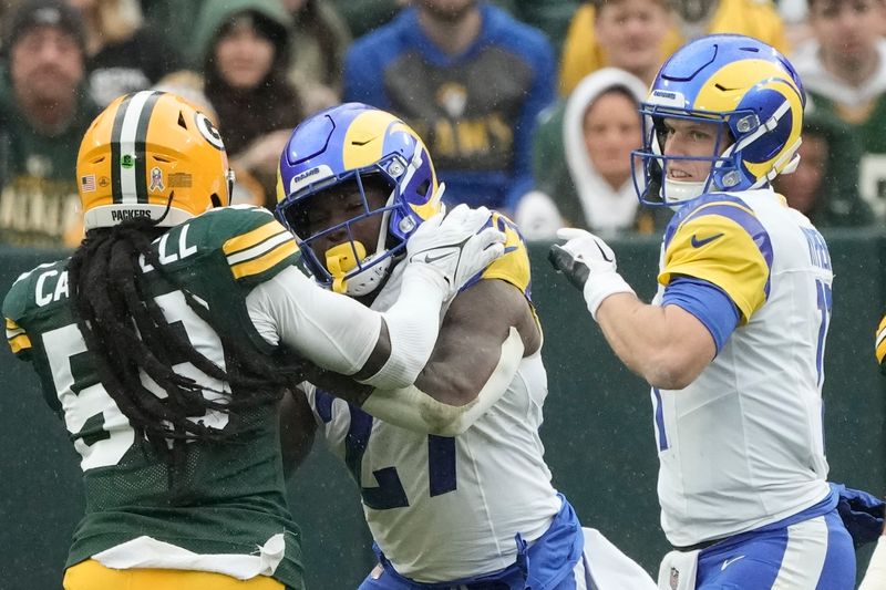 Los Angeles Rams' Brett Rypien throws during the first half of an NFL football game against the Green Bay Packers Sunday, Nov. 5, 2023, in Green Bay, Wis. (AP Photo/Morry Gash)