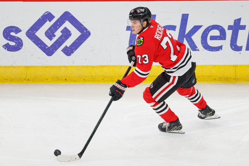 Nov 19, 2024; Chicago, Illinois, USA; Chicago Blackhawks left wing Lukas Reichel (73) controls the puck against the Anaheim Ducks during the third period at United Center. Mandatory Credit: Kamil Krzaczynski-Imagn Images