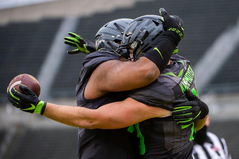 Nov 21, 2020; Eugene, Oregon, USA; Oregon Ducks tight end Hunter Kampmoyer (48) celebrates with teammates after catching a touchdown pass during the second half against the UCLA Bruins at Autzen Stadium. The Ducks won 38-35. Mandatory Credit: Troy Wayrynen-USA TODAY Sports