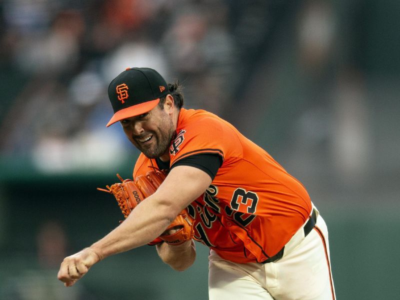 Aug 9, 2024; San Francisco, California, USA; San Francisco Giants starting pitcher Robbie Ray (23) delivers a pitch against the Detroit Tigers during the first inning at Oracle Park. Mandatory Credit: D. Ross Cameron-USA TODAY Sports