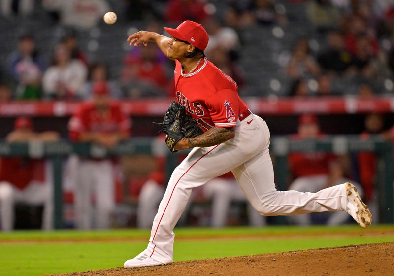 Sep 27, 2023; Anaheim, California, USA; Los Angeles Angels relief pitcher Kelvin Caceres (71) throws to the plate in his major league debut in the ninth inning against the Texas Rangers at Angel Stadium. Mandatory Credit: Jayne Kamin-Oncea-USA TODAY Sports
