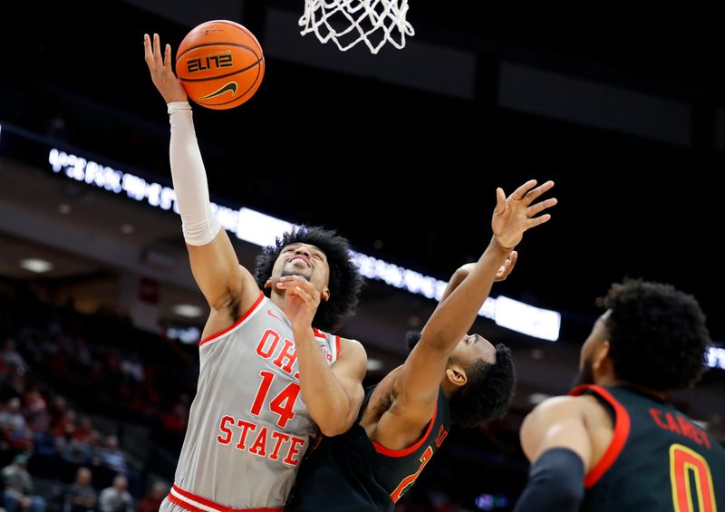 Mar 1, 2023; Columbus, Ohio, USA; Ohio State Buckeyes forward Justice Sueing (14) shoots over Maryland Terrapins guard Jahari Long (2) during the second half at Value City Arena. Mandatory Credit: Joseph Maiorana-USA TODAY Sports