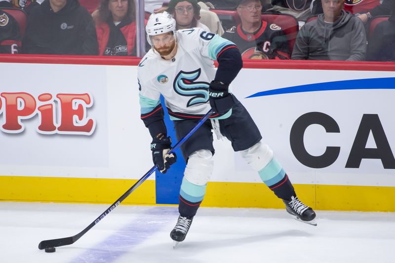 Nov 2, 2024; Ottawa, Ontario, CAN; Seattle Kraken defenseman Adam Larsson (6) skates with the puck in the third period against the Ottawa Senators at the Canadian Tire Centre. Mandatory Credit: Marc DesRosiers-Imagn Images