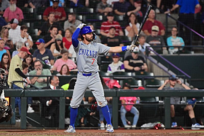 Apr 17, 2024; Phoenix, Arizona, USA;  Chicago Cubs shortstop Dansby Swanson (7) at bat in the sixth inning against the Arizona Diamondbacks at Chase Field. Mandatory Credit: Matt Kartozian-USA TODAY Sports