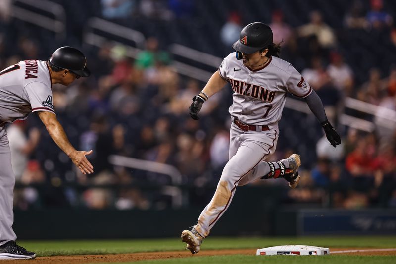 Jun 7, 2023; Washington, District of Columbia, USA; Arizona Diamondbacks left fielder Corbin Carroll (7) celebrates with third base coach Tony Perezchica (21) after hitting a two run home run against the Washington Nationals during the ninth inning at Nationals Park. Mandatory Credit: Scott Taetsch-USA TODAY Sports