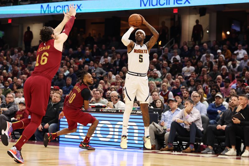 CLEVELAND, OH - FEBRUARY 23: Kentavious Caldwell-Pope #5 of the Denver Nuggets shoots a three point basket during the game against the Cleveland Cavaliers on February 23, 2023 at Rocket Mortgage FieldHouse in Cleveland, Ohio. NOTE TO USER: User expressly acknowledges and agrees that, by downloading and/or using this Photograph, user is consenting to the terms and conditions of the Getty Images License Agreement. Mandatory Copyright Notice: Copyright 2022 NBAE (Photo by  Lauren Bacho/NBAE via Getty Images)