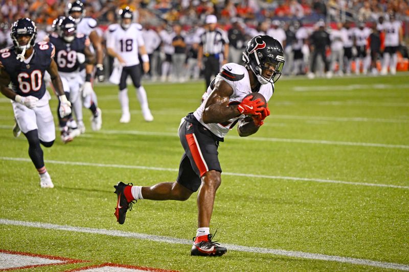 Houston Texans running back Cam Akers catches a pass for a touchdown during the first half of an NFL exhibition Hall of Fame football game against the Chicago Bears, Thursday, Aug. 1, 2024, in Canton, Ohio. (AP Photo/David Richard)