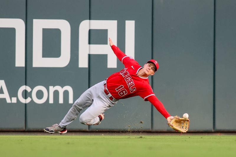 Aug 1, 2023; Atlanta, Georgia, USA; Los Angeles Angels center fielder Mickey Moniak (16) dives for a fly ball against the Atlanta Braves in the first inning at Truist Park. Mandatory Credit: Brett Davis-USA TODAY Sports