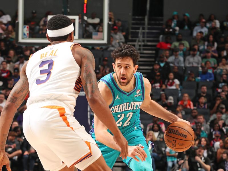 CHARLOTTE, NC - MARCH 15: Vasilije Micic #22 of the Charlotte Hornets  handles the ball during the game against the Phoenix Suns on March 15, 2024 at Spectrum Center in Charlotte, North Carolina. NOTE TO USER: User expressly acknowledges and agrees that, by downloading and or using this photograph, User is consenting to the terms and conditions of the Getty Images License Agreement. Mandatory Copyright Notice: Copyright 2024 NBAE (Photo by Kent Smith/NBAE via Getty Images)