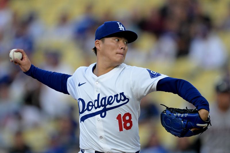 May 20, 2024; Los Angeles, California, USA;  Los Angeles Dodgers starting pitcher Yoshinobu Yamamoto (18) delivers to the plate in the first inning against the Arizona Diamondbacks at Dodger Stadium. Mandatory Credit: Jayne Kamin-Oncea-USA TODAY Sports