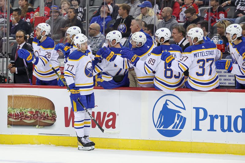 Oct 27, 2023; Newark, New Jersey, USA; Buffalo Sabres right wing JJ Peterka (77) celebrates his goal with teammates during the first period against the New Jersey Devils at Prudential Center. Mandatory Credit: Vincent Carchietta-USA TODAY Sports