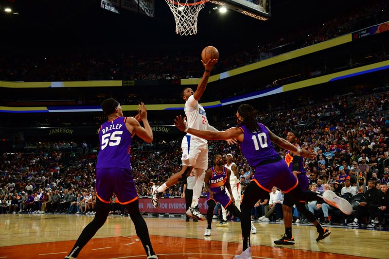 PHOENIX, AZ - APRIL  9: Norman Powell #24 of the LA Clippers shoots the ball during the game against the Phoenix Suns on April 9, 2023 at Footprint Center in Phoenix, Arizona. NOTE TO USER: User expressly acknowledges and agrees that, by downloading and or using this photograph, user is consenting to the terms and conditions of the Getty Images License Agreement. Mandatory Copyright Notice: Copyright 2023 NBAE (Photo by Kate Frese/NBAE via Getty Images)