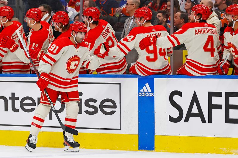 Feb 24, 2024; Edmonton, Alberta, CAN; The Calgary Flames celebrate a goal scored by forward Name Kadri (91) during the first period against the Edmonton Oilers at Rogers Place. Mandatory Credit: Perry Nelson-USA TODAY Sports