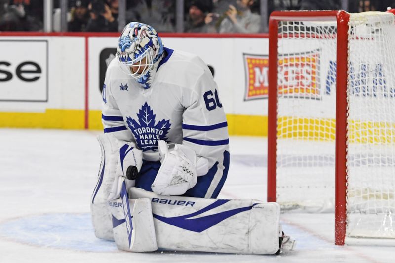 Jan 7, 2025; Philadelphia, Pennsylvania, USA; Toronto Maple Leafs goaltender Joseph Woll (60) makes a save against the Philadelphia Flyers during the first period at Wells Fargo Center. Mandatory Credit: Eric Hartline-Imagn Images