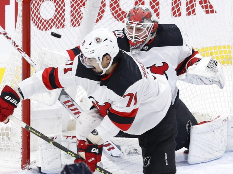 Apr 2, 2023; Winnipeg, Manitoba, CAN; Winnipeg Jets left wing Nikolaj Ehlers (27) scores on New Jersey Devils goaltender Vitek Vanecek (41) as New Jersey Devils defenseman Jonas Siegenthaler (71) tries to block the shot in the third period at Canada Life Centre. Mandatory Credit: James Carey Lauder-USA TODAY Sports