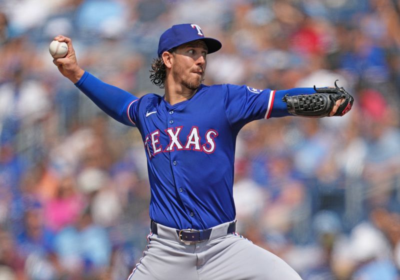 Jul 27, 2024; Toronto, Ontario, CAN; Texas Rangers starting pitcher Michael Lorenzen (23) throws a pitch against the Toronto Blue Jays during the first inning at Rogers Centre. Mandatory Credit: Nick Turchiaro-USA TODAY Sports