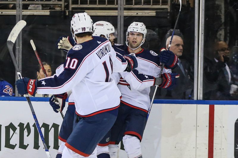 Nov 12, 2023; New York, New York, USA; Columbus Blue Jackets center Adam Fantilli (11) celebrates with his teammates after scoring in the second period against the New York Rangers at Madison Square Garden. Mandatory Credit: Wendell Cruz-USA TODAY Sports