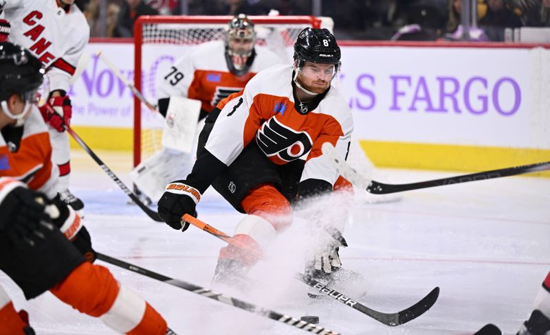 Nov 28, 2023; Philadelphia, Pennsylvania, USA; Philadelphia Flyers defenseman Cam York (8) defends a pass against the Carolina Hurricanes in the third period at Wells Fargo Center. Mandatory Credit: Kyle Ross-USA TODAY Sports