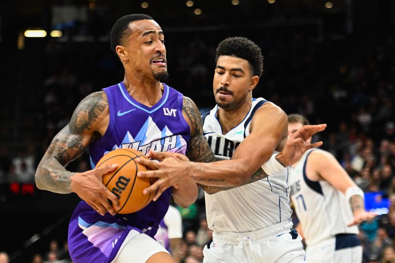 SALT LAKE CITY, UTAH - NOVEMBER 14: John Collins #20 of the Utah Jazz drives into Quentin Grimes #5 of the Dallas Mavericks during the second half of a game at Delta Center on November 14, 2024 in Salt Lake City, Utah. NOTE TO USER: User expressly acknowledges and agrees that, by downloading and or using this photograph, User is consenting to the terms and conditions of the Getty Images License Agreement.  (Photo by Alex Goodlett/Getty Images)