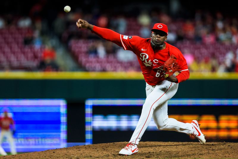 May 3, 2025; Cincinnati, Ohio, USA; Cincinnati Reds relief pitcher Luis Mey (62) pitches against the Washington Nationals in the ninth inning at Great American Ball Park. Mandatory Credit: Katie Stratman-Imagn Images