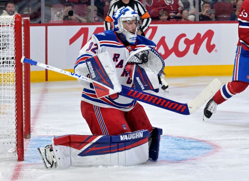 Oct 18, 2025; Montreal, Quebec, CAN; New York Rangers goalie Jonathan Quick (32) makes a glove save during the second period of the game against the Montreal Canadiens at the Bell Centre. Mandatory Credit: Eric Bolte-Imagn Images