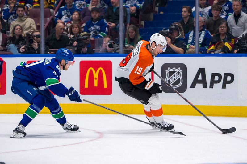 Oct 11, 2024; Vancouver, British Columbia, CAN; Philadelphia Flyers forward Garnet Hathaway (19) drives past Vancouver Canucks forward Elias Pettersson (40) during the second period at Rogers Arena. Mandatory Credit: Bob Frid-Imagn Images