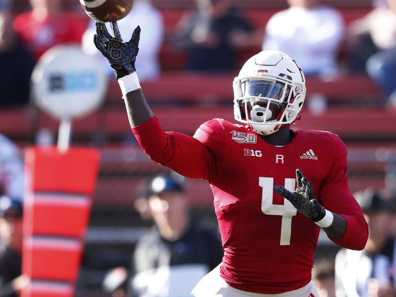 Oct 19, 2019; Piscataway, NJ, USA; Rutgers Scarlet Knights running back Aaron Young (4) throws a pass against the Minnesota Golden Gophers during the first half at SHI Stadium. Mandatory Credit: Noah K. Murray-USA TODAY Sports