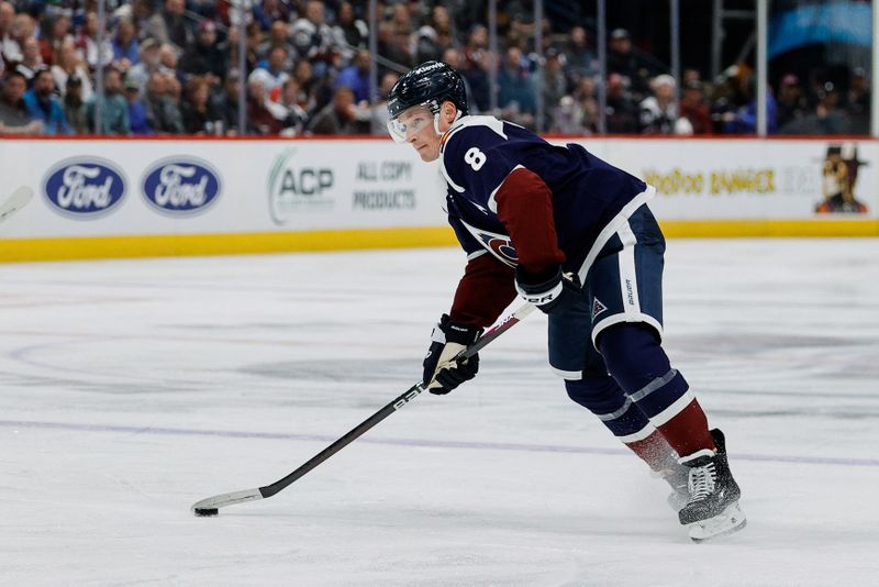 Apr 9, 2024; Denver, Colorado, USA; Colorado Avalanche defenseman Cale Makar (8) controls the puck in the second period against the Minnesota Wild at Ball Arena. Mandatory Credit: Isaiah J. Downing-USA TODAY Sports