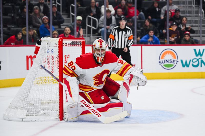 Nov 27, 2024; Detroit, Michigan, USA; Calgary Flames goaltender Dan Vladar (80) defends the net during the game against the Detroit Red Wings at Little Caesars Arena. Mandatory Credit: Tim Fuller-Imagn Images