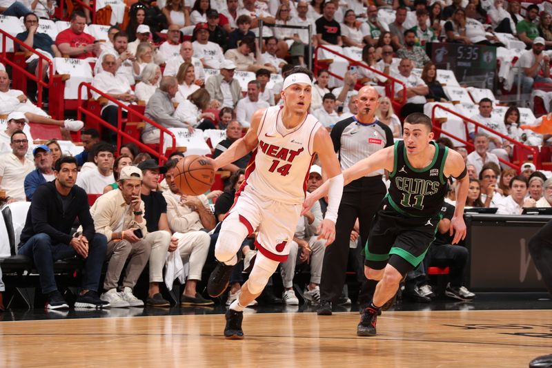 MIAMI, FL - APRIL 27: Tyler Herro #14 of the Miami Heat drives to the basket during the game against the Boston Celtics during Round 1 Game 3 of the 2024 NBA Playoffs on April 27, 2024 at Kaseya Center in Miami, Florida. NOTE TO USER: User expressly acknowledges and agrees that, by downloading and or using this Photograph, user is consenting to the terms and conditions of the Getty Images License Agreement. Mandatory Copyright Notice: Copyright 2024 NBAE (Photo by Issac Baldizon/NBAE via Getty Images)