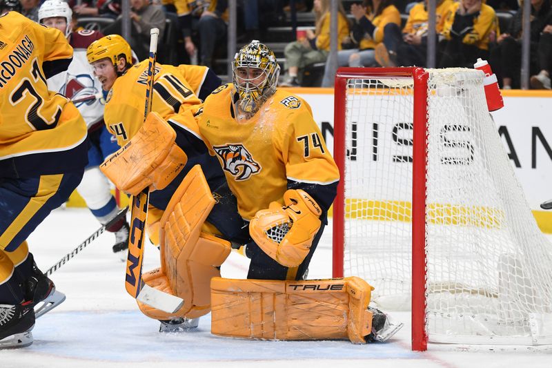 Mar 2, 2024; Nashville, Tennessee, USA; Nashville Predators goaltender Juuse Saros (74) watches the puck after a save during the second period against the Colorado Avalanche at Bridgestone Arena. Mandatory Credit: Christopher Hanewinckel-USA TODAY Sports