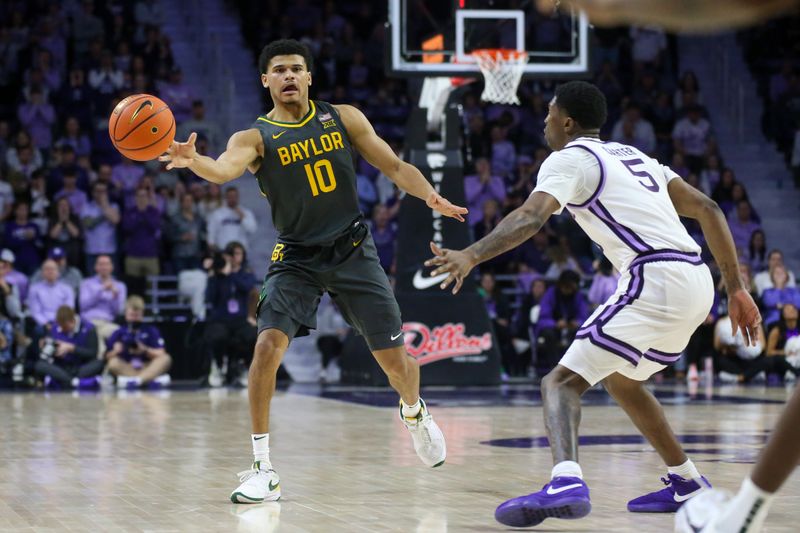 Jan 16, 2024; Manhattan, Kansas, USA; Baylor Bears guard RayJ Dennis (10) passes the ball while guarded by Kansas State Wildcats guard Cam Carter (5) during overtime at Bramlage Coliseum. Mandatory Credit: Scott Sewell-USA TODAY Sports