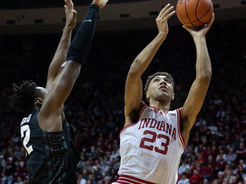 Jan 22, 2023; Bloomington, Indiana, USA; Indiana Hoosiers forward Trayce Jackson-Davis (23) shoots the ball while Michigan State Spartans center Mady Sissoko (22) defends in the first half at Simon Skjodt Assembly Hall. Mandatory Credit: Trevor Ruszkowski-USA TODAY Sports