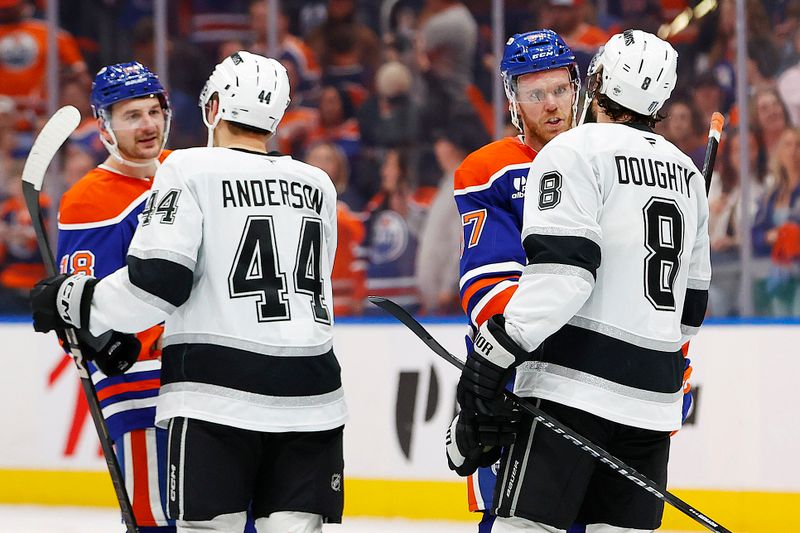 May 1, 2025; Edmonton, Alberta, CAN; Edmonton Oilers forward Connor McDavid (97) and forward Zach Hyman (18) shakes hands with Los Angeles Kings defensemen Mikey Anderson (44) and Los Angeles Kings defensemen Drew Doughty (8) after the Oilers eliminated the Kings in game six of the first round of the 2025 Stanley Cup Playoffs at Rogers Place. Mandatory Credit: Perry Nelson-Imagn Images