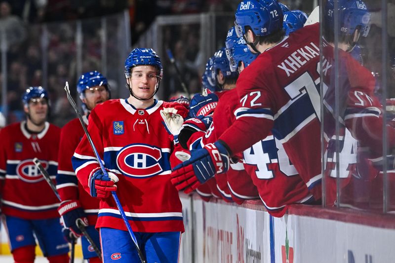 Jan 12, 2026; Montreal, Quebec, CAN; Montreal Canadiens center Oliver Kapanen (91) celebratew with his teammates at the bench his goal against the Vancouver Canucks during the third period at Bell Centre. Mandatory Credit: David Kirouac-Imagn Images