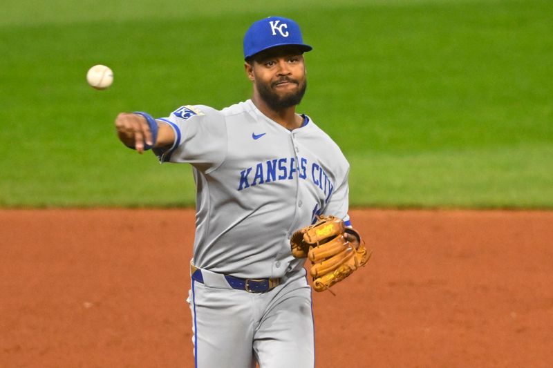 Sep 10, 2025; Cleveland, Ohio, USA; Kansas City Royals third baseman Maikel Garcia (11) throws to first base in the sixth inning against the Cleveland Guardians at Progressive Field. Mandatory Credit: David Richard-Imagn Images