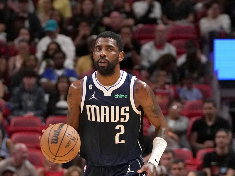 MIAMI, FL - APRIL 1:  Kyrie Irving #2 of the Dallas Mavericks dribbles the ball against the Miami Heat on April 1, 2023 at FTX Arena in Miami, Florida. NOTE TO USER: User expressly acknowledges and agrees that, by downloading and or using this Photograph, user is consenting to the terms and conditions of the Getty Images License Agreement. Mandatory Copyright Notice: Copyright 2023 NBAE (Photo by Issac Baldizon/NBAE via Getty Images)