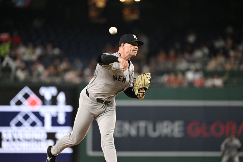 Aug 28, 2024; Washington, District of Columbia, USA; New York Yankees relief pitcher Jake Cousins (61) throws a pitch against the Washington Nationals during the seventh inning at Nationals Park. Mandatory Credit: Rafael Suanes-USA TODAY Sports