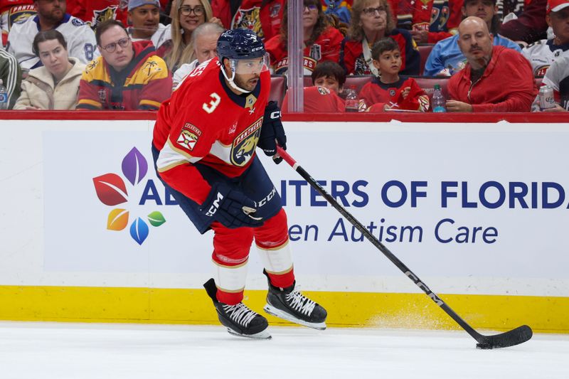 Apr 26, 2025; Sunrise, Florida, USA; Florida Panthers defenseman Seth Jones (3) controls the puck against the Tampa Bay Lightning in the first period during game three of the first round of the 2025 Stanley Cup Playoffs at Amerant Bank Arena. Mandatory Credit: Nathan Ray Seebeck-Imagn Images